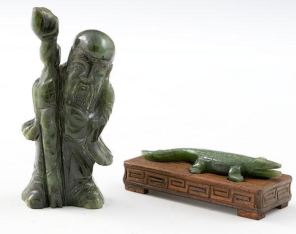 Appraisal: TWO CARVED CHINESE JADE FIGURES both green jade includes figure