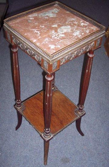 Appraisal: A French marble topped two-tier table on turned legs and