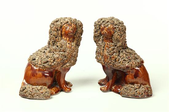 Appraisal: PAIR OF ROCKINGHAM DOGS Probably American nd half- th century