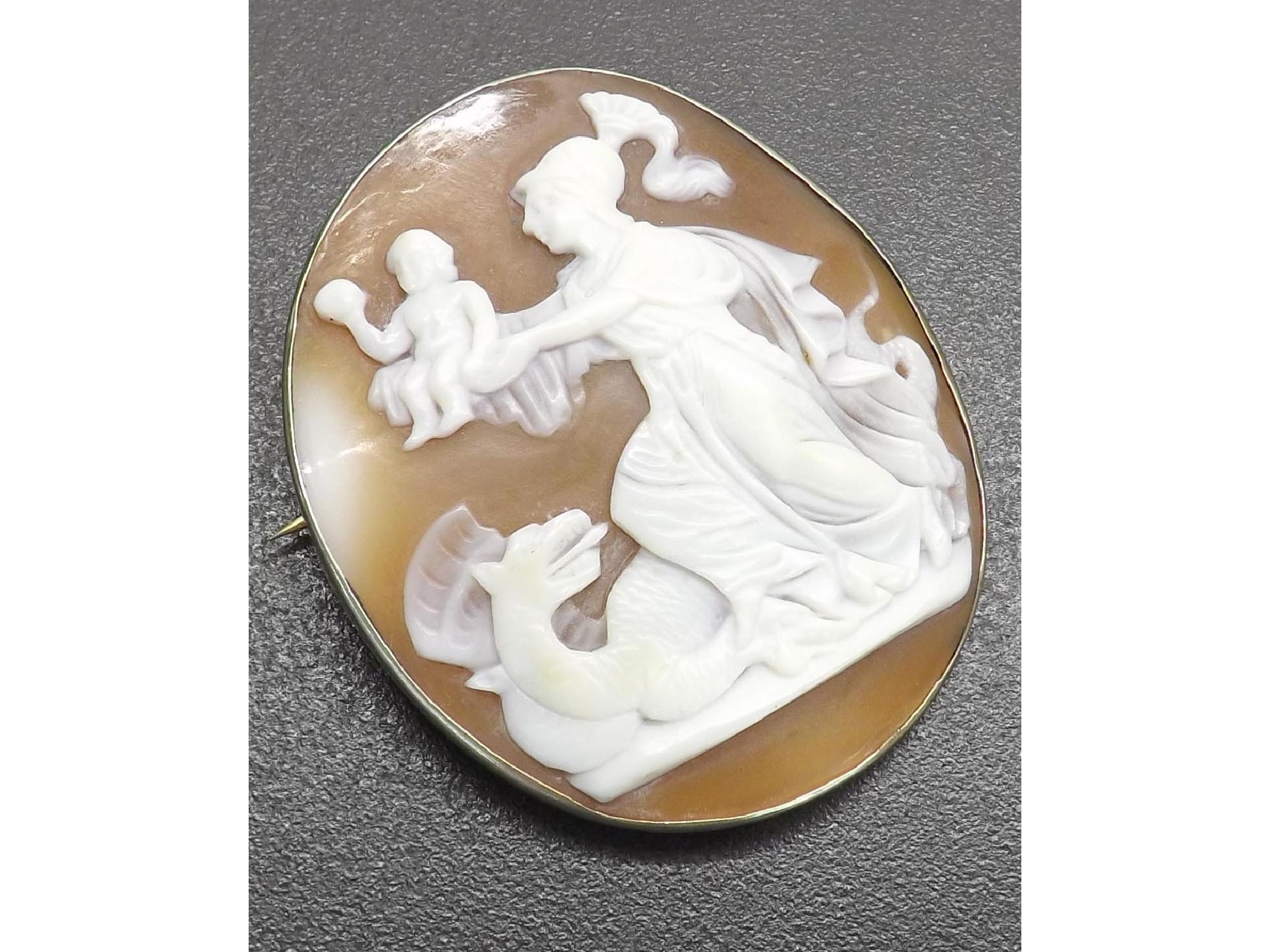 Appraisal: Oval shell cameo brooch depicting figures and a dragon within