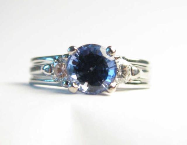 Appraisal: A K white gold ring with ct round center tanzanite