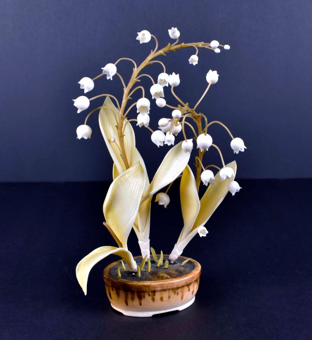 Appraisal: CHINESE CARVED POTTED DEW-DROP PLANTAppears unsigned With green leaves delicate