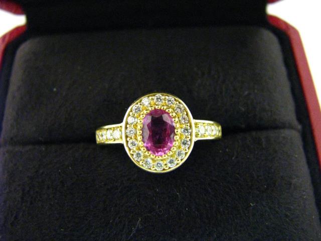 Appraisal: A Cartier K yellow gold ring with oval center ruby