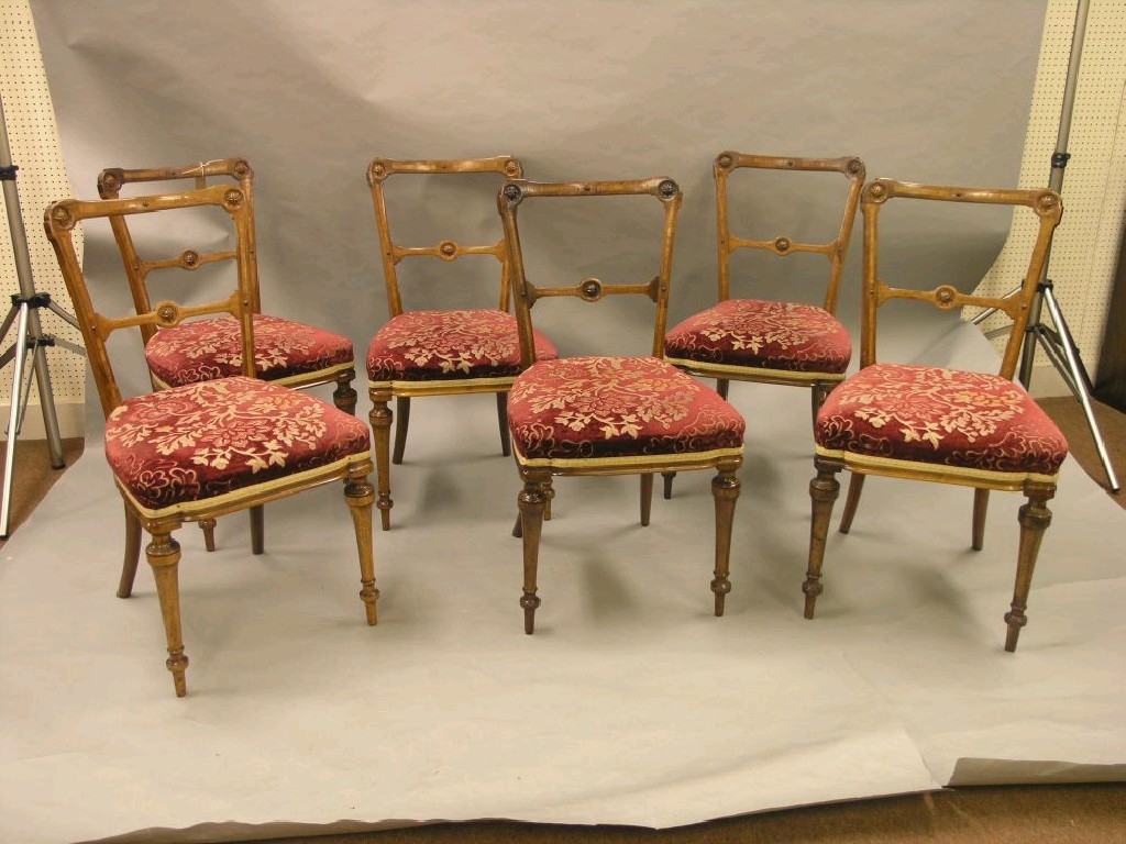 Appraisal: A set of six Victorian inlaid walnut dining chairs bar-backs