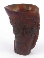 Appraisal: A horn libation cup carved with Chinese scenes ht cm