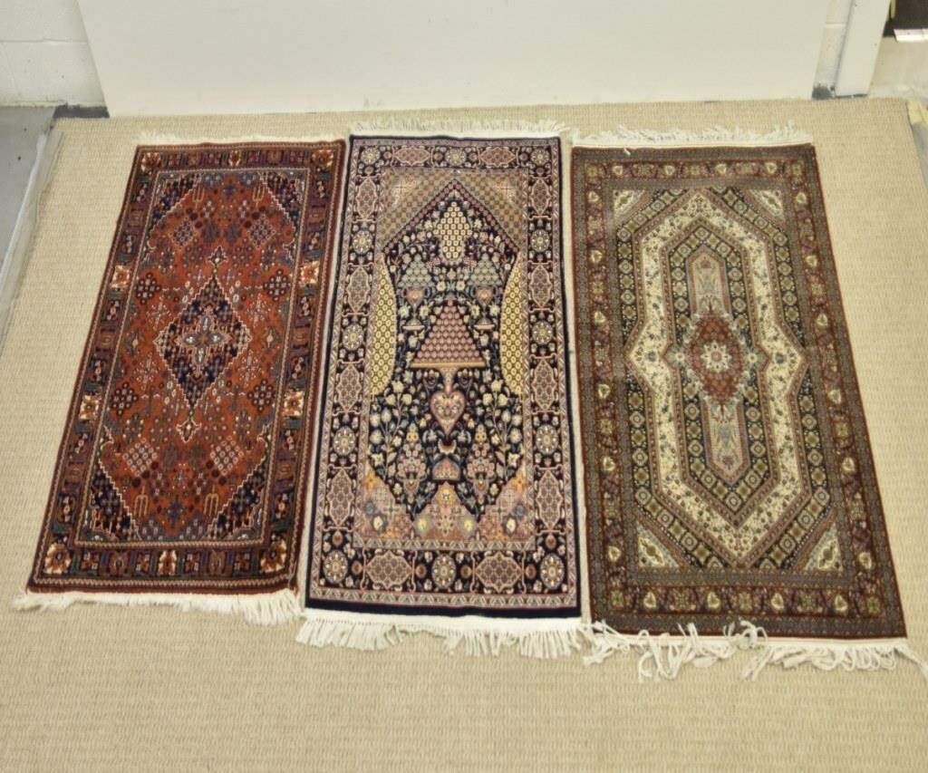 Appraisal: Three colorful Persian carpets all th c Largest ' x