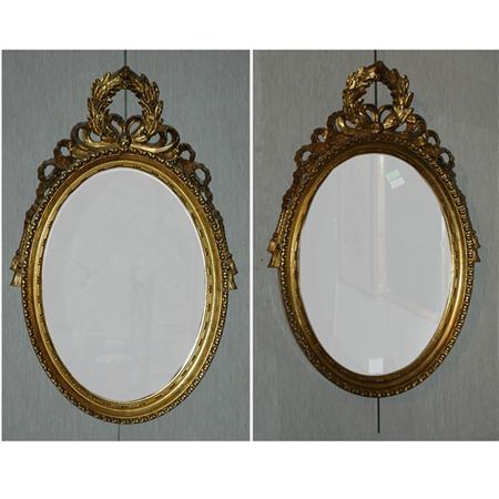 Appraisal: Pair of Neoclassical Style Gilt-Wood Oval Mirrors Estimate -