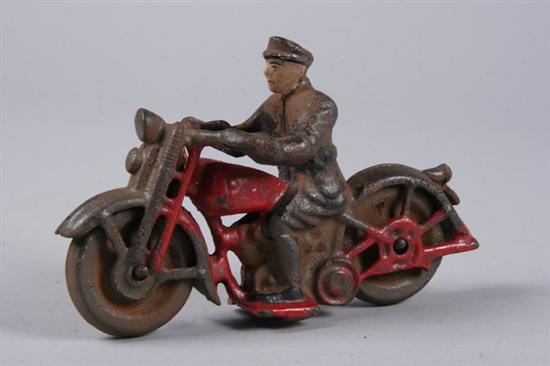 Appraisal: CAST IRON PATROL MOTORCYCLE AND DRIVER Metal wheels Areas of