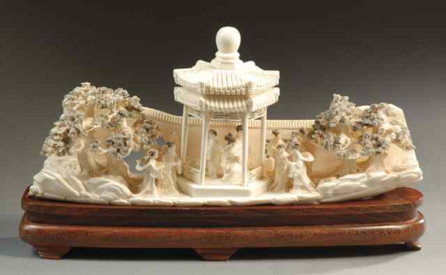 Appraisal: IVORY CARVED LANDSCAPE with twelve Chinese women inside and beside