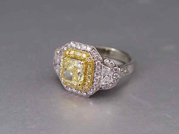 Appraisal: A NATURAL FANCY YELLOW DIAMOND RING GIA report Platinum and