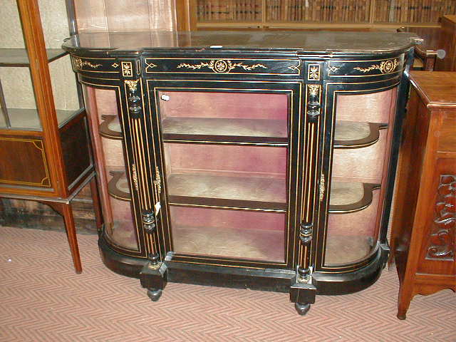 Appraisal: A Victorian ebonised credenza with gilt scratch carved decoration wide