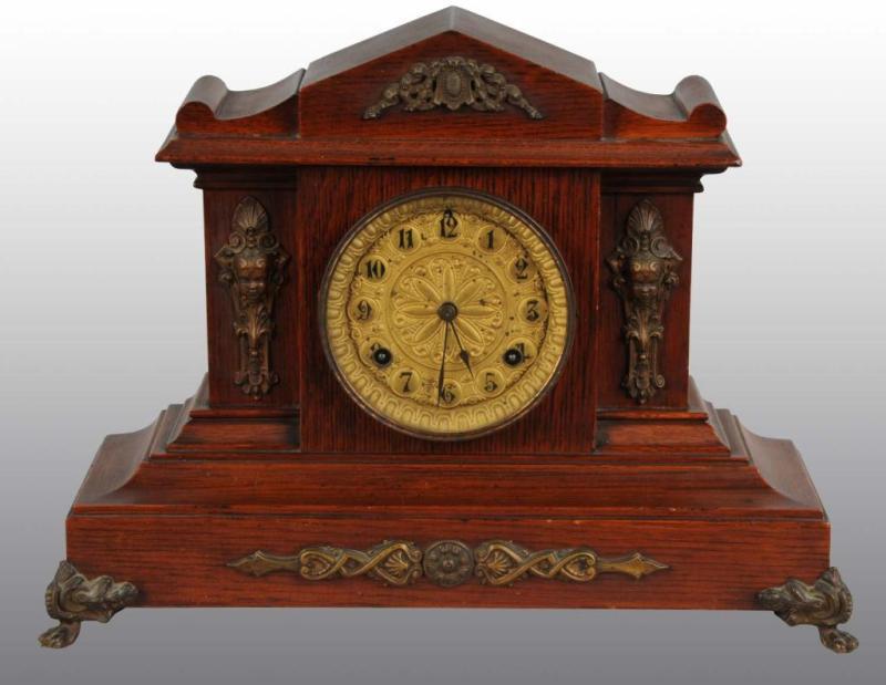 Appraisal: Oak Waterbury Mantle Clock with Brass Decanter Description Time and