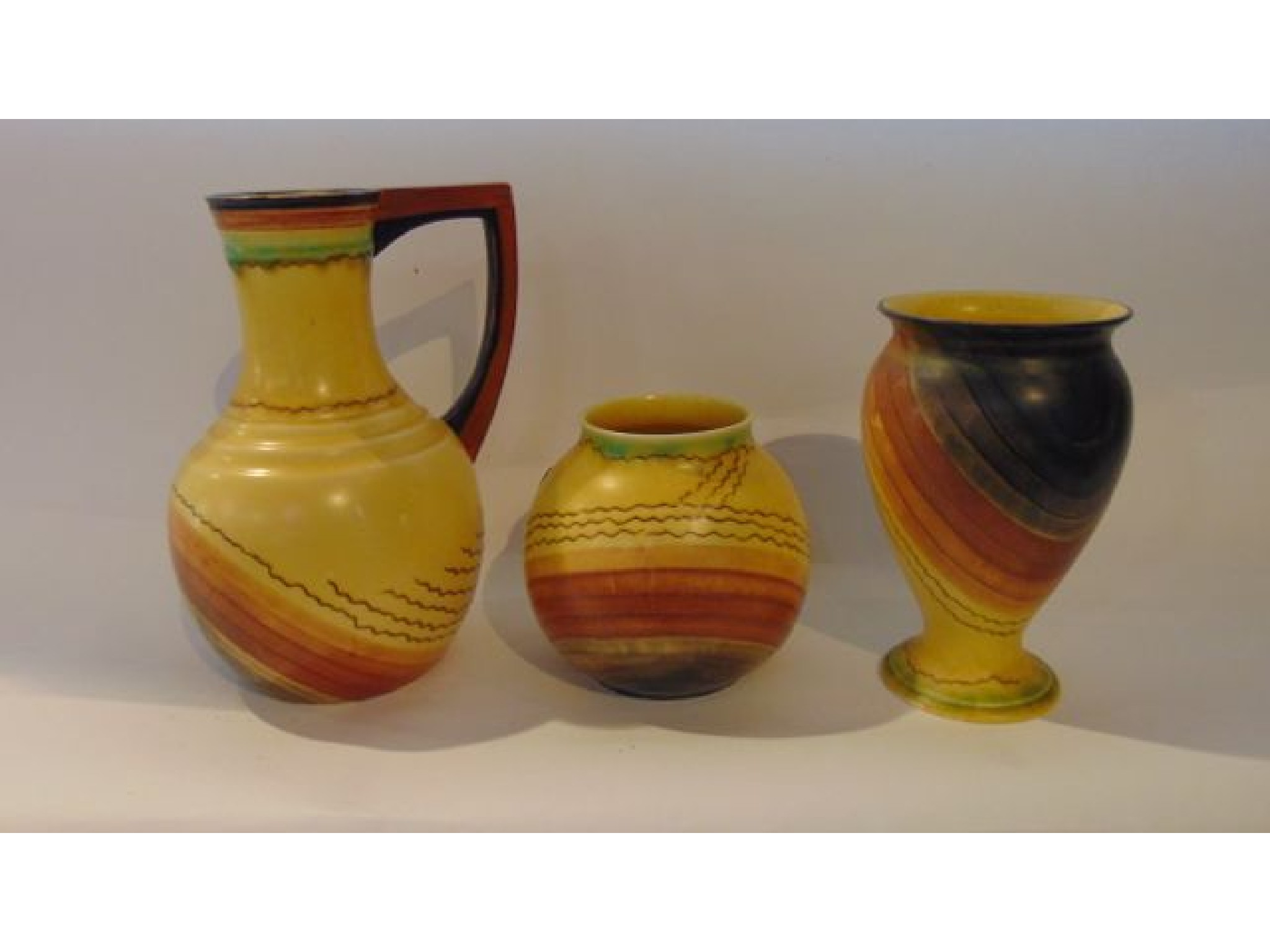 Appraisal: A collection of three pieces of yellow ground Carlton Ware