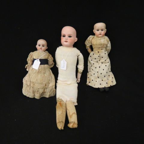 Appraisal: Victorian Bisque Head Dolls w o wigs and a with