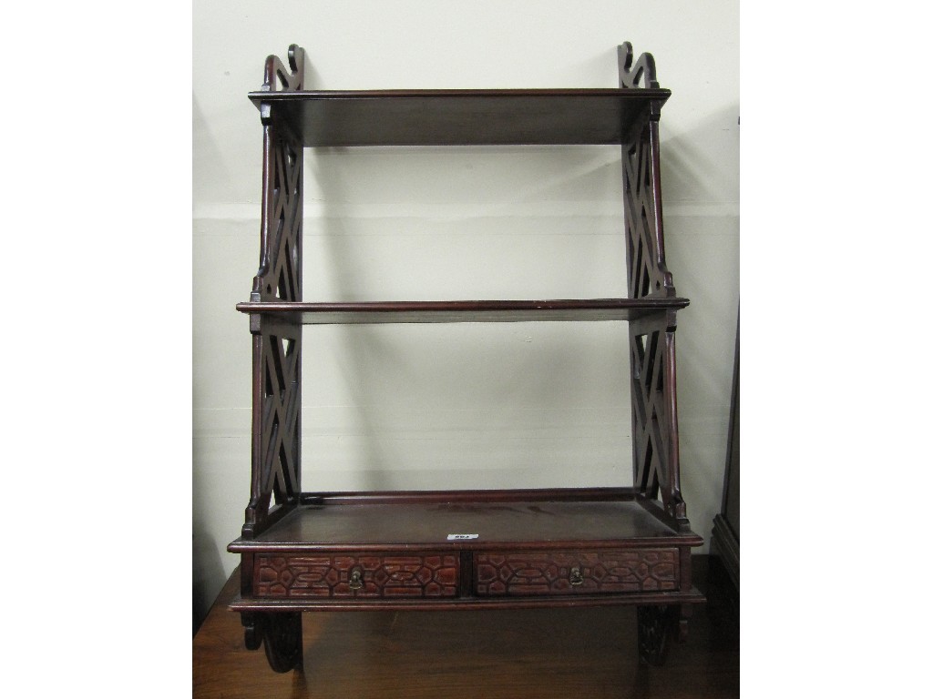 Appraisal: Edwardian mahogany hanging three tier bookshelves