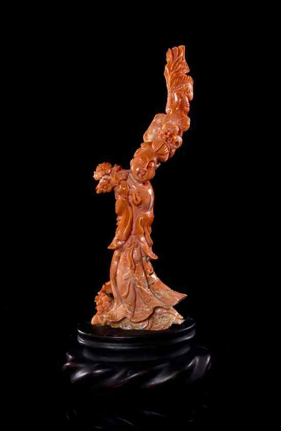 Appraisal: A Carved Coral Model of a Woman the stone of