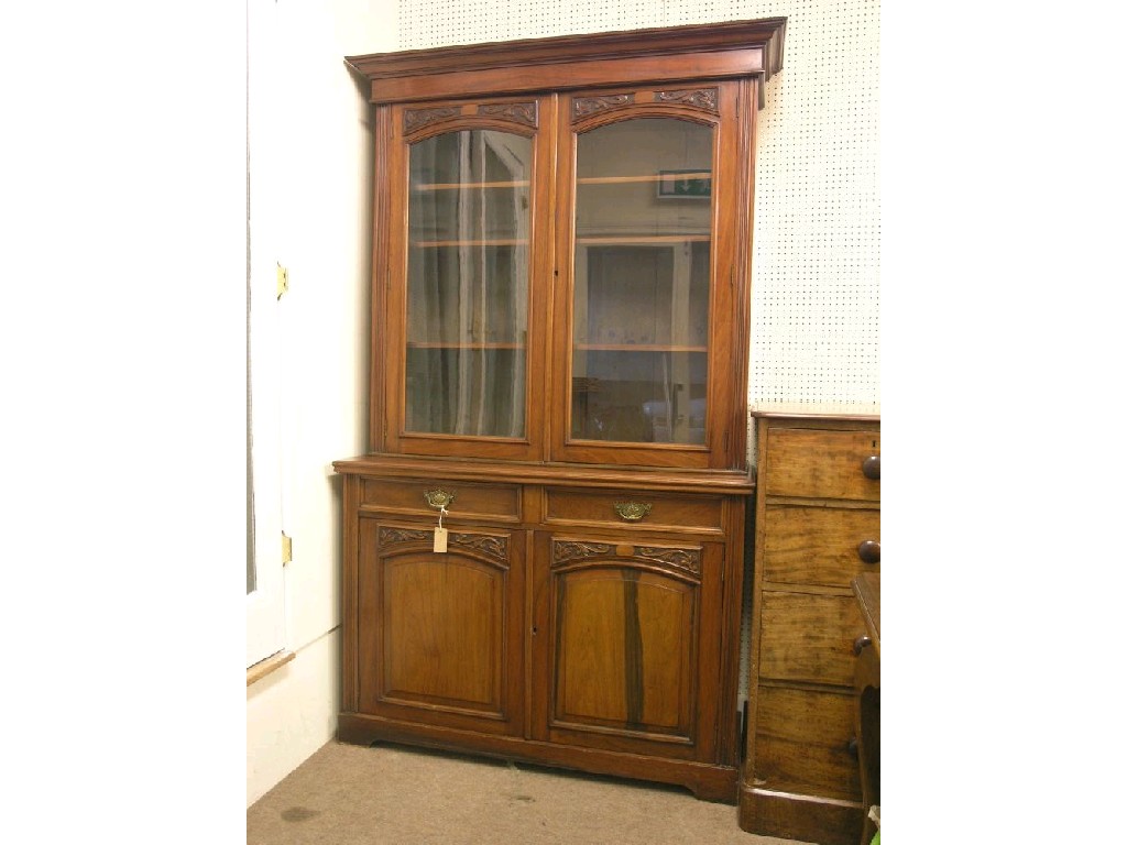 Appraisal: A Victorian solid walnut bookcase upper stage having a pair