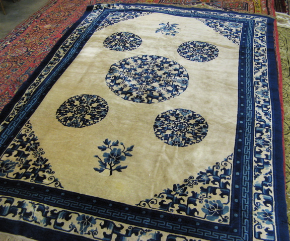 Appraisal: PEKING CARPET blue and ivory ' x '