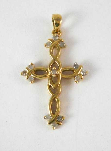 Appraisal: DIAMOND AND TEN KARAT GOLD CROSS PENDANT set with round-cut