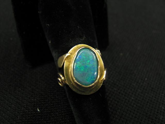 Appraisal: Black Opal Ring fiery blue green gem k yellow gold