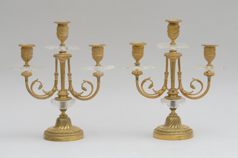 Appraisal: PAIR OF LOUIS XVI STYLE GILT-BRONZE-MOUNTED ROCK CRYSTAL THREE-LIGHT CANDELABRA