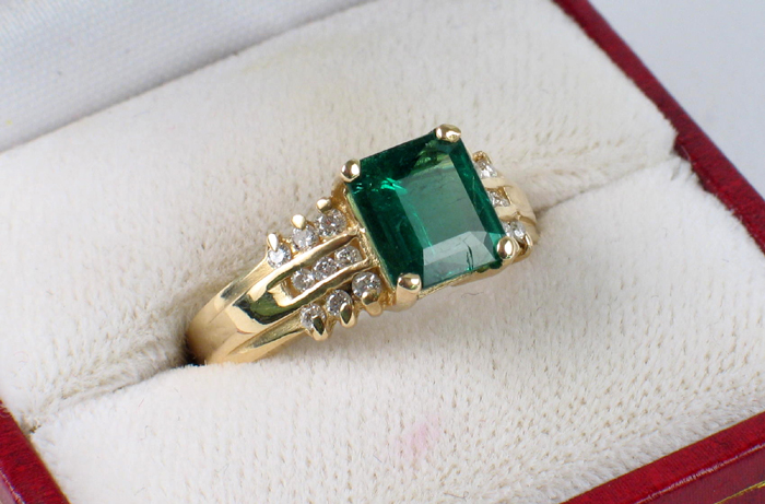 Appraisal: EMERALD DIAMOND AND FOURTEEN KARAT GOLD RING Centered and prong