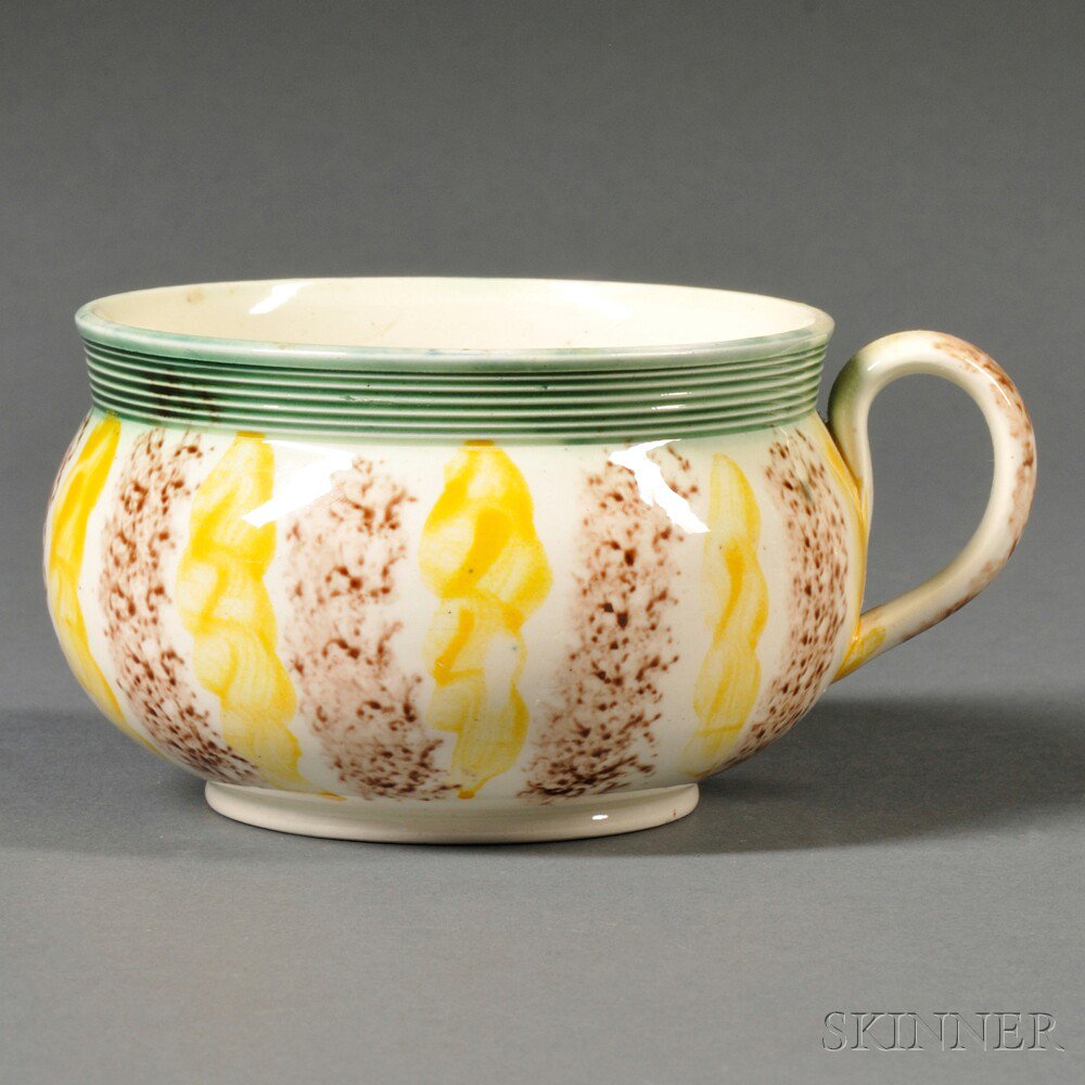 Appraisal: Staffordshire Cream-colored Earthenware Porridge Cup England c green glazed and