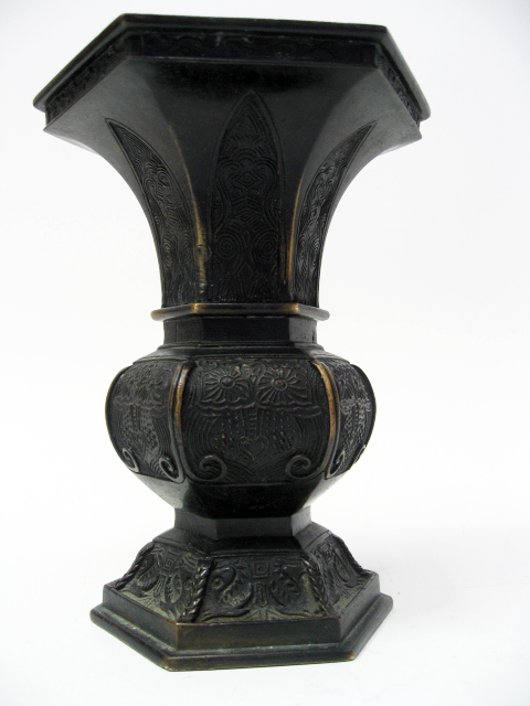 Appraisal: An Early Hexagonal Chinese Bronze Vase having an intricate relief