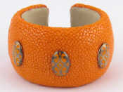 Appraisal: A shagreen stingray galuchat and leather cased bangle with white