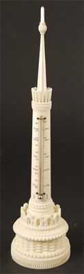 Appraisal: A th century ornamentally turned ivory desk thermometer with a