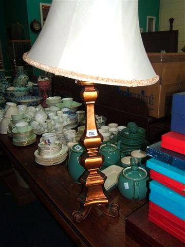 Appraisal: An Italian gilt wood table lamp standing on three scrolling