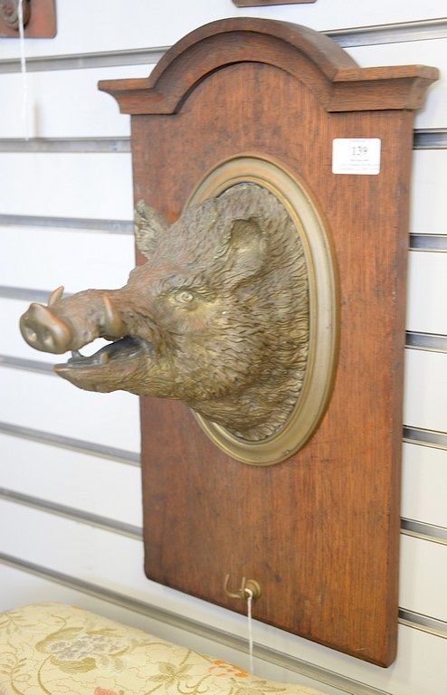 Appraisal: Brass boar head mounted on oak panel ht in Brass