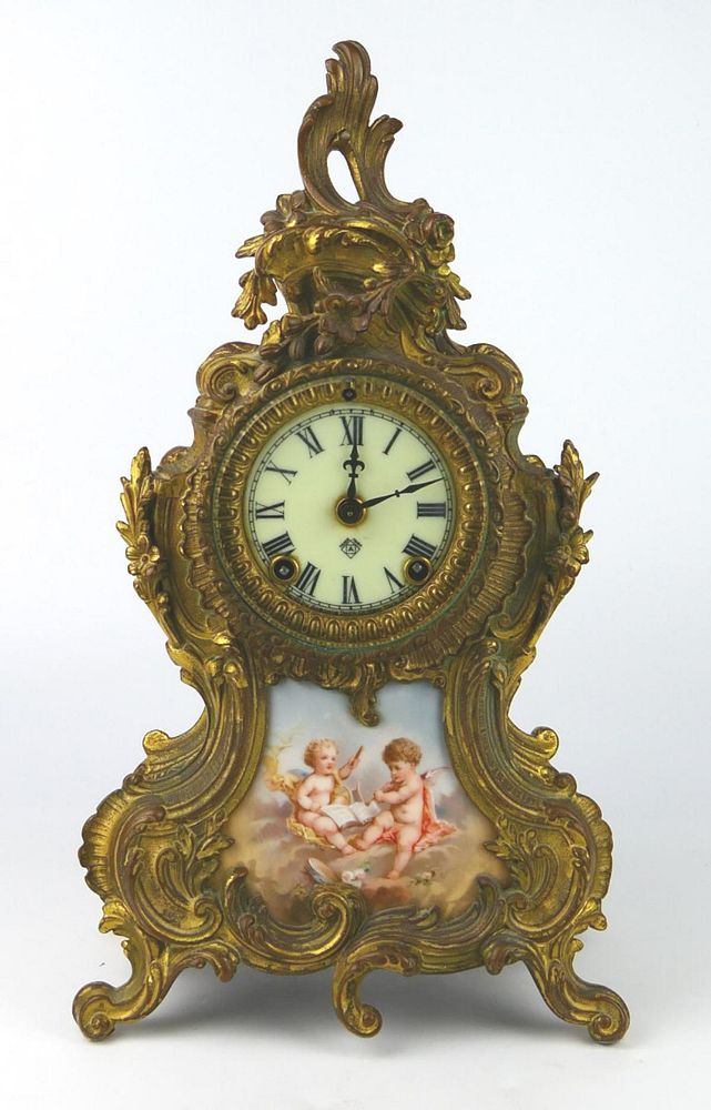 Appraisal: ANSONIA ANTIQUE FRENCH METAL CLOCK CHERUB MOTIF Measures tall has