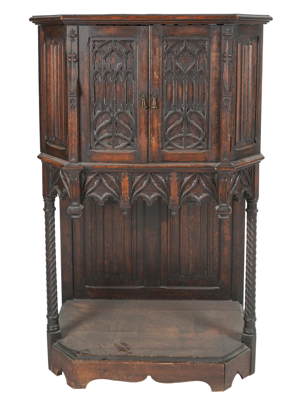 Appraisal: GOTHIC REVIVAL CARVED OAK CABINETcirca the pair of hinged doors