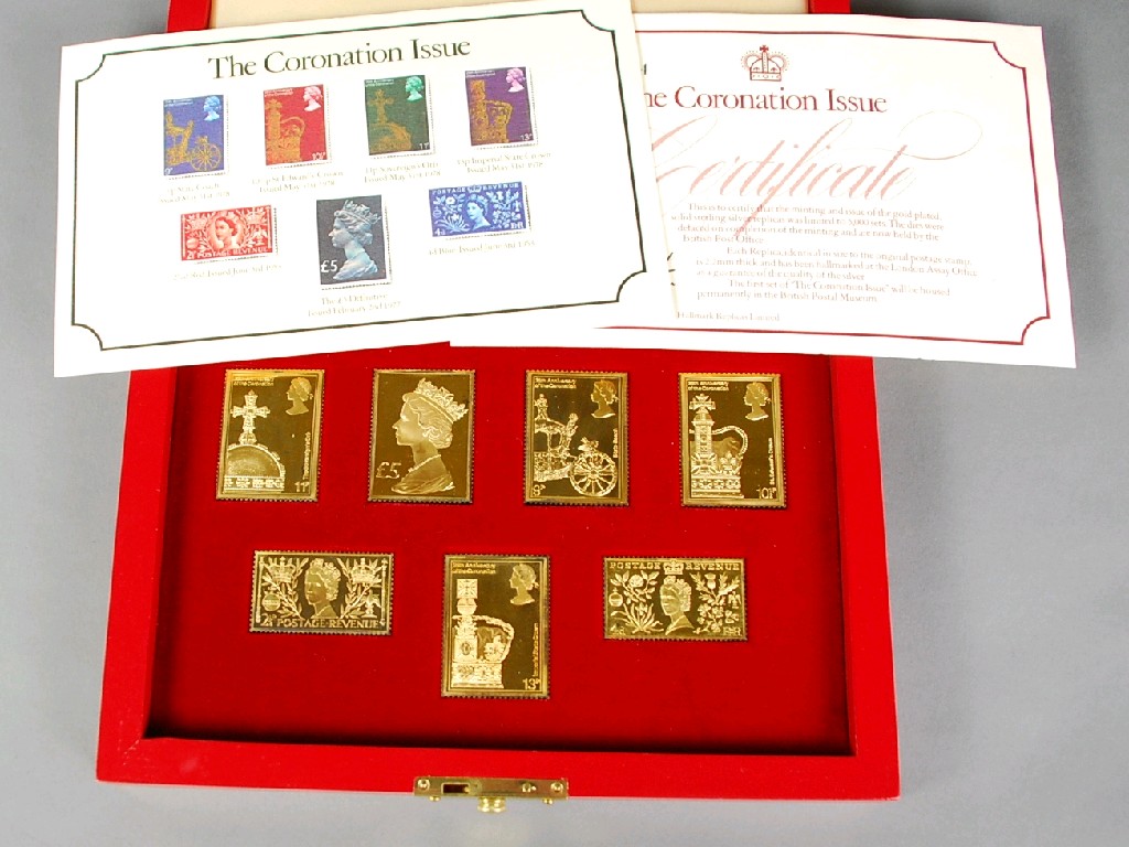 Appraisal: SET OF SEVEN SILVER GILT REPLICA POSTAGE STAMPS 'The Coronation