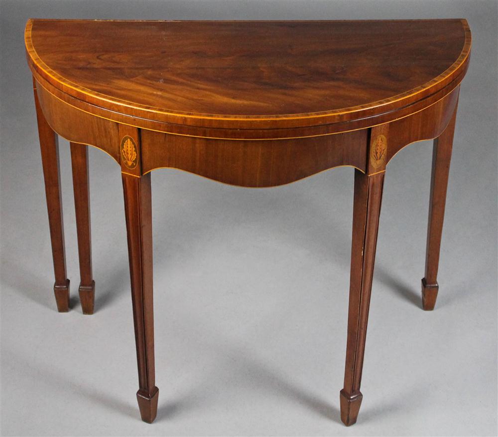 Appraisal: GEORGIAN NEOCLASSICAL INLAID MAHOGANY CARD TABLE having a demilune hinged