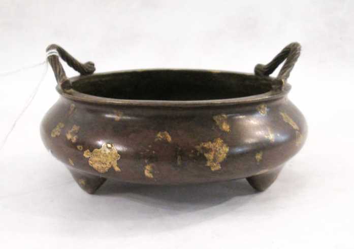 Appraisal: CHINESE SPLASH GOLD BRONZE CENSER tri-footed patinated bronze with handles