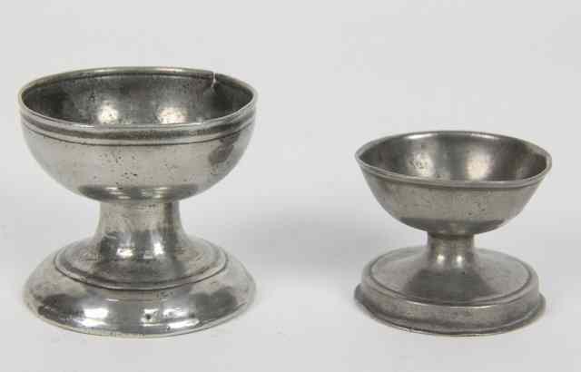 Appraisal: Two pewter cup and capstan salts one bearing a Cotterell