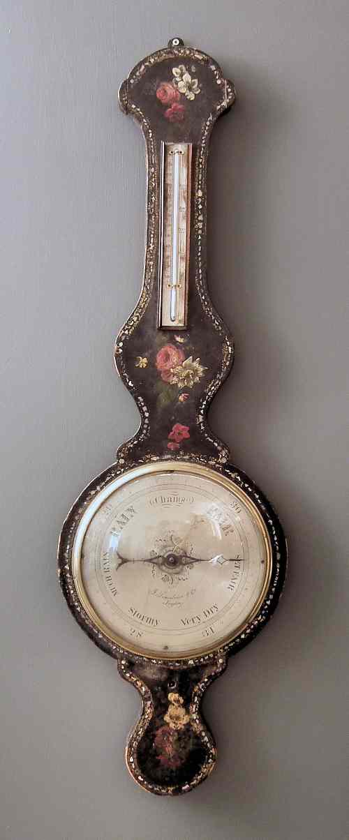 Appraisal: A Victorian black papier mache cased wheel barometer and thermometer