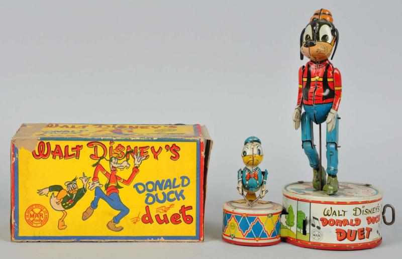 Appraisal: Tin Marx Disney Donald Duck Duet Wind-Up Toy Description American