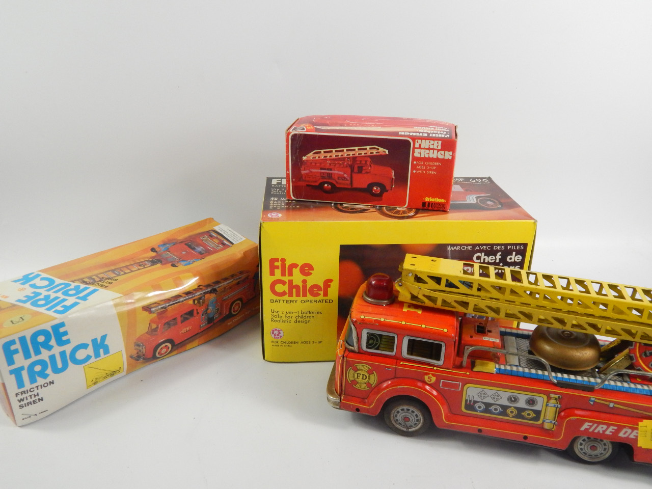 Appraisal: Various clockwork and other tin plate fire engines to include