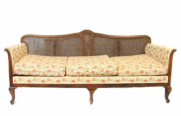 Appraisal: An English upholstered and caned back settee height in length