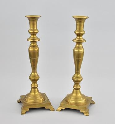 Appraisal: A Pair of Large Brass Candleholders The simple classic turned