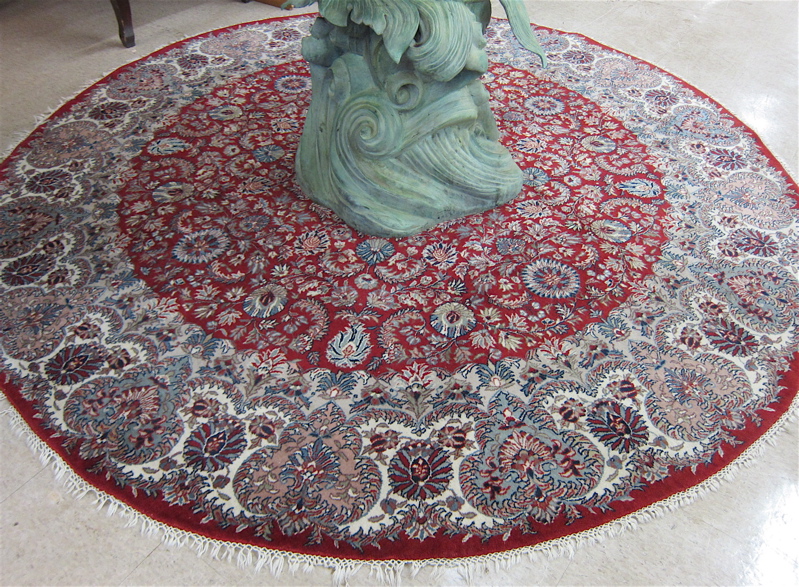 Appraisal: ROUND ORIENTAL CARPET Indo-Persian floral and central floral medallion design