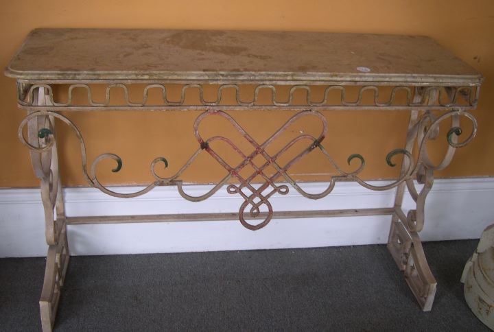 Appraisal: Polychromed Wrought-Iron and Beige Marble-Top Console Table in intertwined scroll