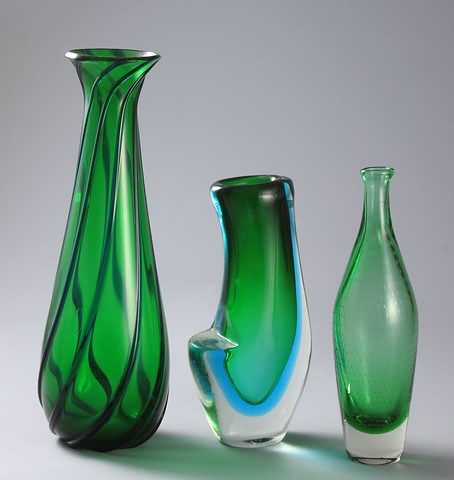 Appraisal: Three vases Tall green vase with applied blue ridges Together