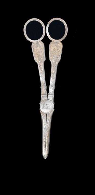 Appraisal: A PAIR OF VICTORIAN GRAPE SHEARS foliate engraved crested by