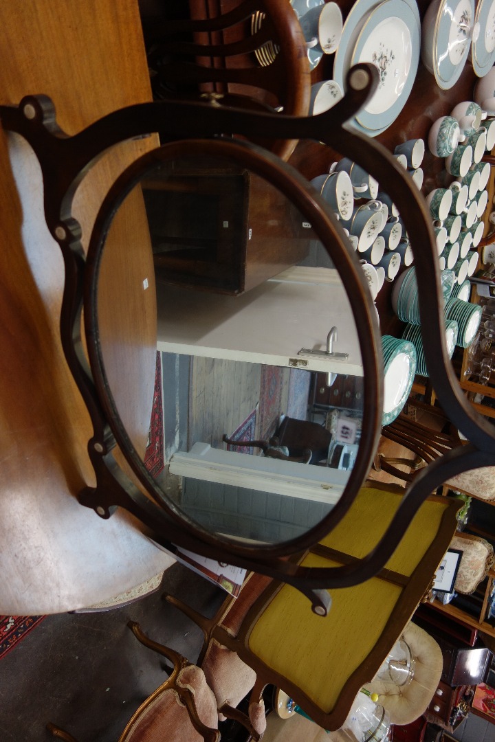 Appraisal: A large George III style mahogany oval swing toilet mirror