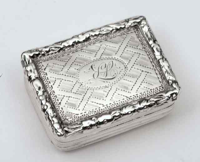 Appraisal: A GEORGE III MINIATURE SILVER VINAIGRETTE with engraved chequered decoration