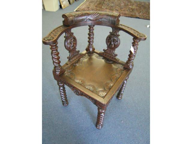 Appraisal: Victorian Carved Oak Corner Chair faces serpent decor